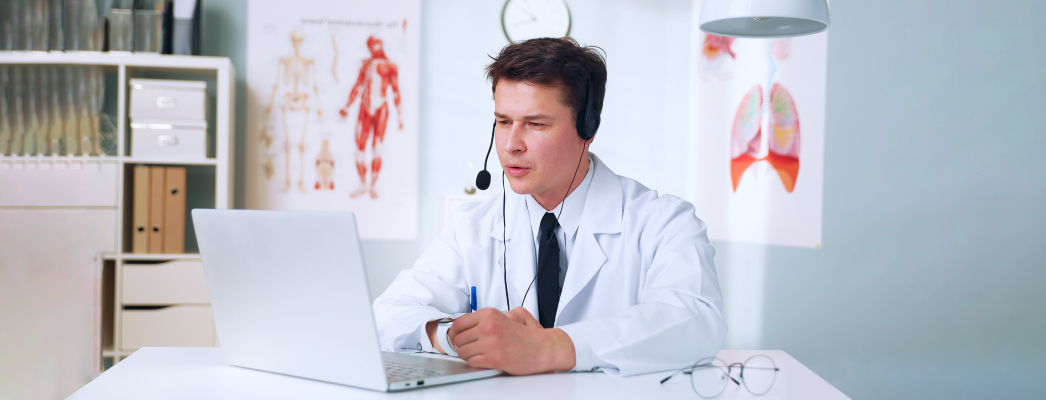 Doctor using digital dictation software for medical transcription.